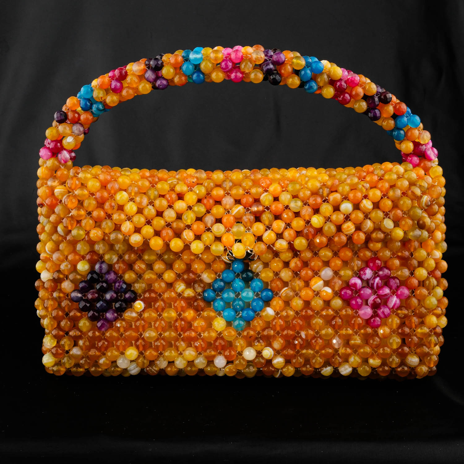 bolso-piedra-natural-agata-madagascar-hecho-a-mano Lussuosa borsa in pietra naturale realizzata a mano con circa 2000 pietre di agata del Madagascar multicolori originali taglio sfaccettato da 8 mm.