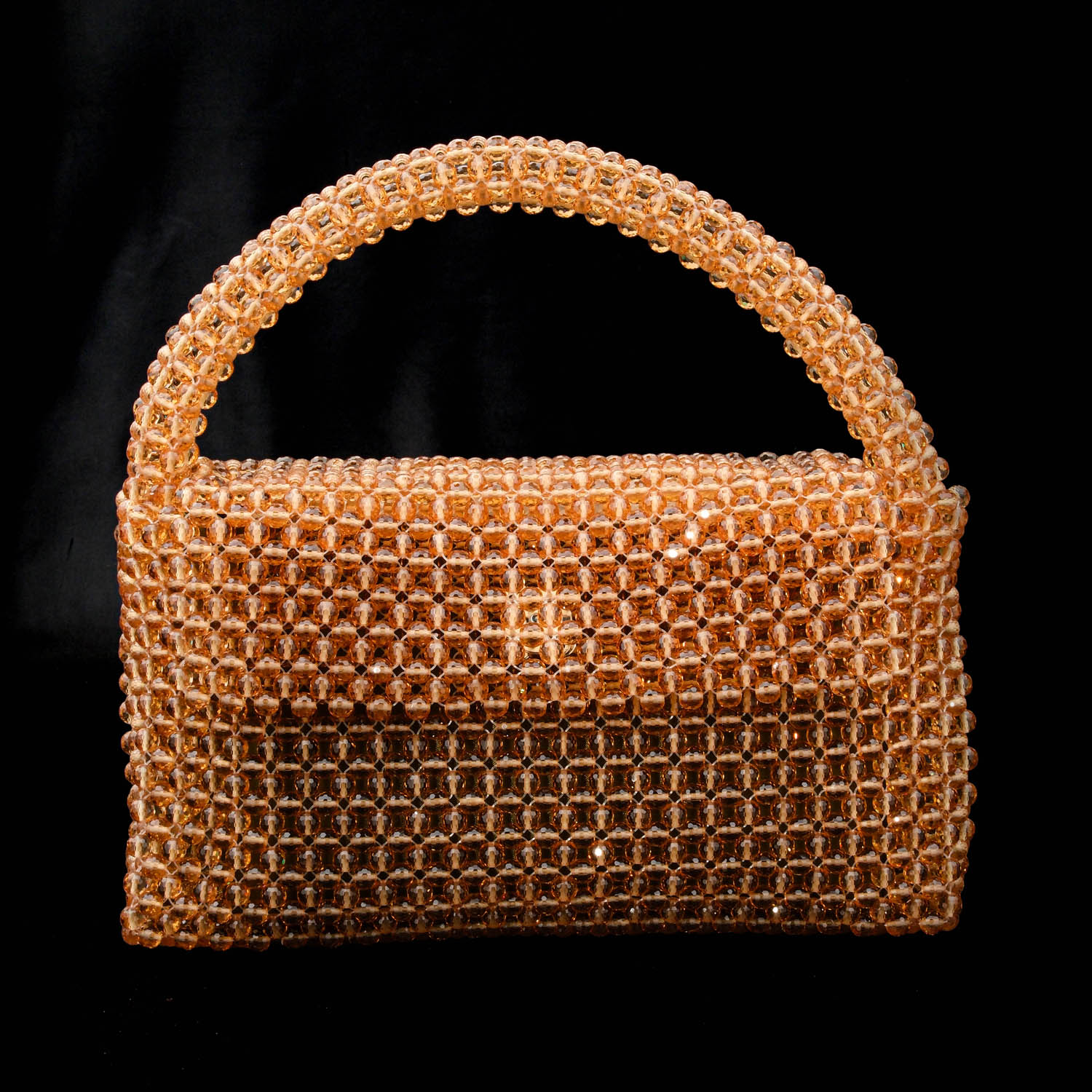 bolso-piedra-natural-zultanita-hecho-a-mano (2) Luxury natural stone bag handcrafted using approximately 2300 pieces of 7mm facet cut zultanite stones that change color according to light.