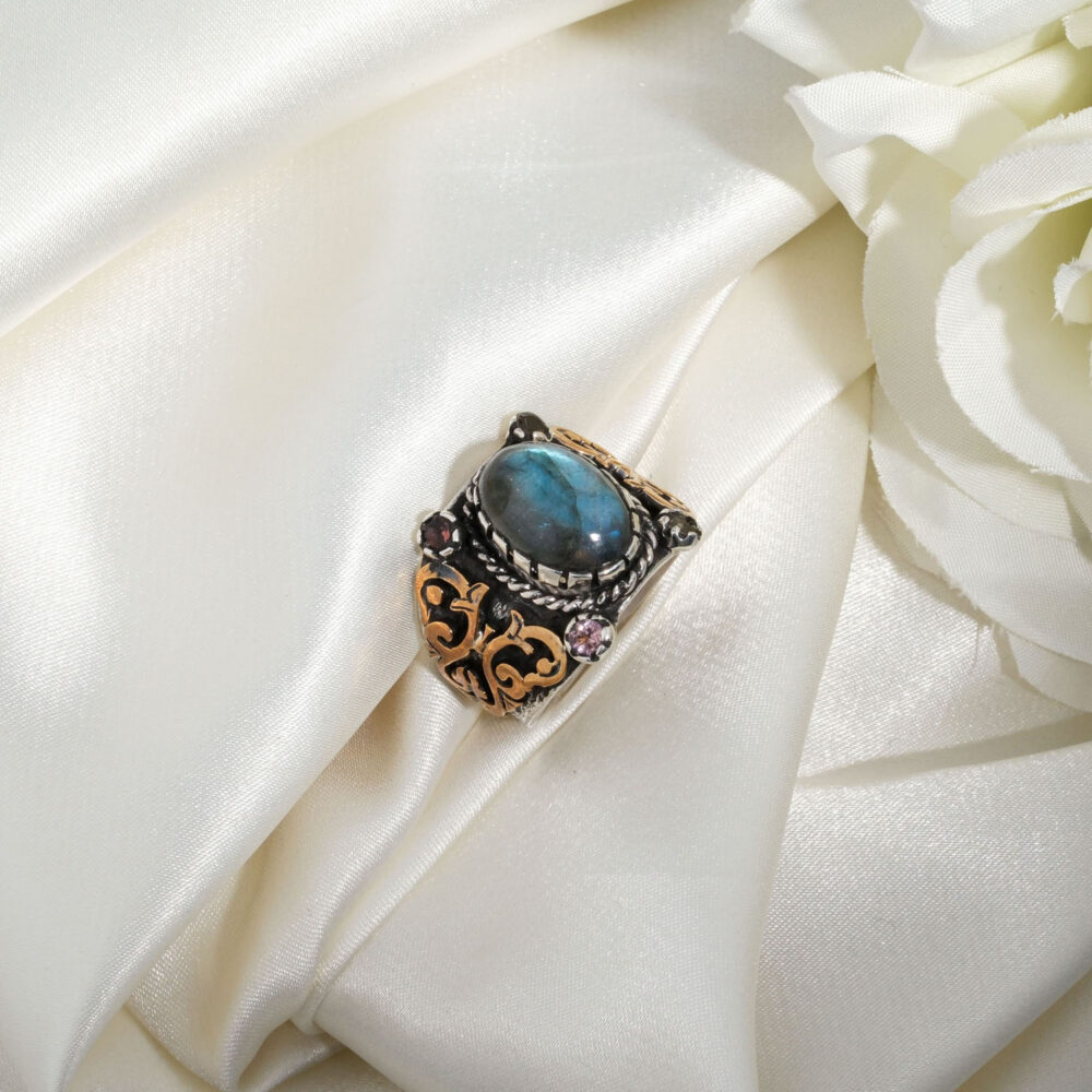 A luxury handmade statement ring featuring an original labradorite and tourmaline gemstones set in 925 sterling silver.