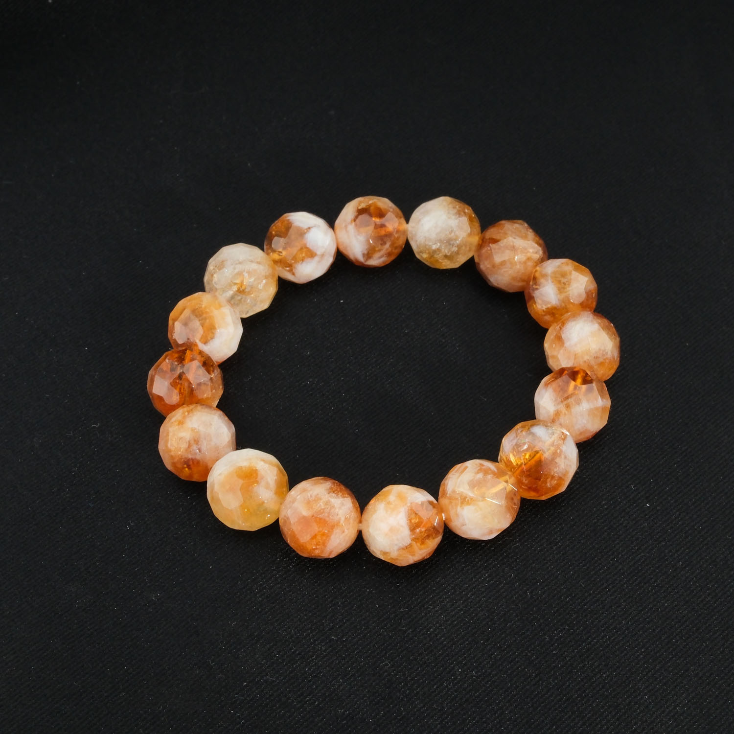 natural-faceted-4a-grade-citrine-gemstone-bracelet-13mm A natural 4A grade faceted honey cognac yellow citrine 12-13mm chunky gemstone unisex stretch bracelet.