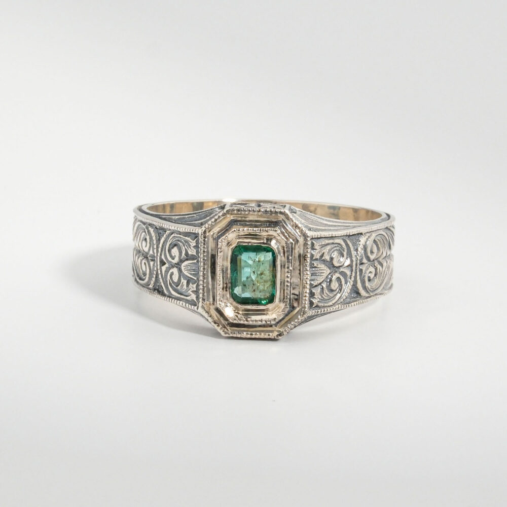 A 925 sterling silver handmade unisex ring featuring a natural square cut Zambian emerald gemstone.