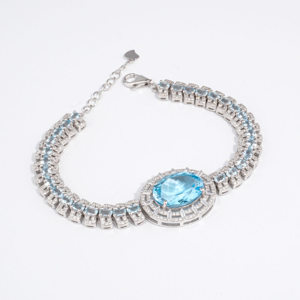 Bracelet de haute joaillerie pour femme en argent 925 rhodié serti d'une topaze bleue naturelle et zircons.