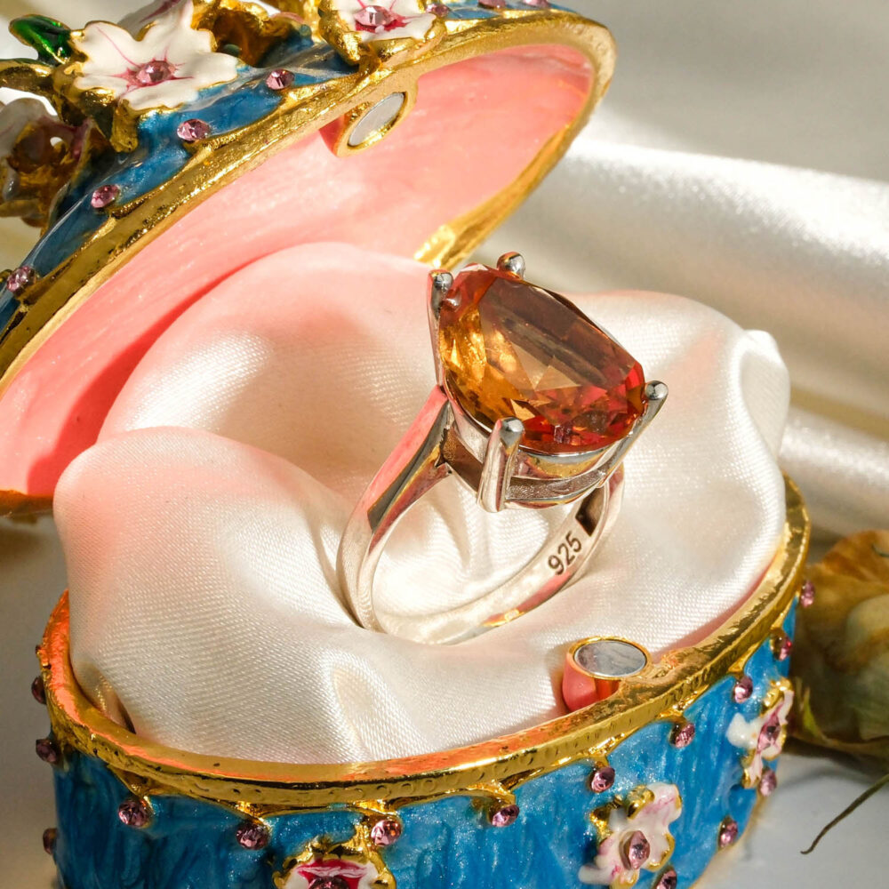 An authentic natural color-change faceted pear-cut zultanite gemstone 925 sterling silver solitaire ring.