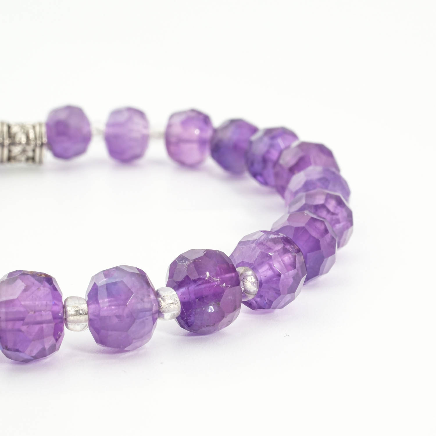 natural-faceted-rondelle-amethyst-gemstone-bracelet-6x8mm An authentic 6x8mm natural purple faceted rondelle amethyst gemstone beaded stretch bracelet.