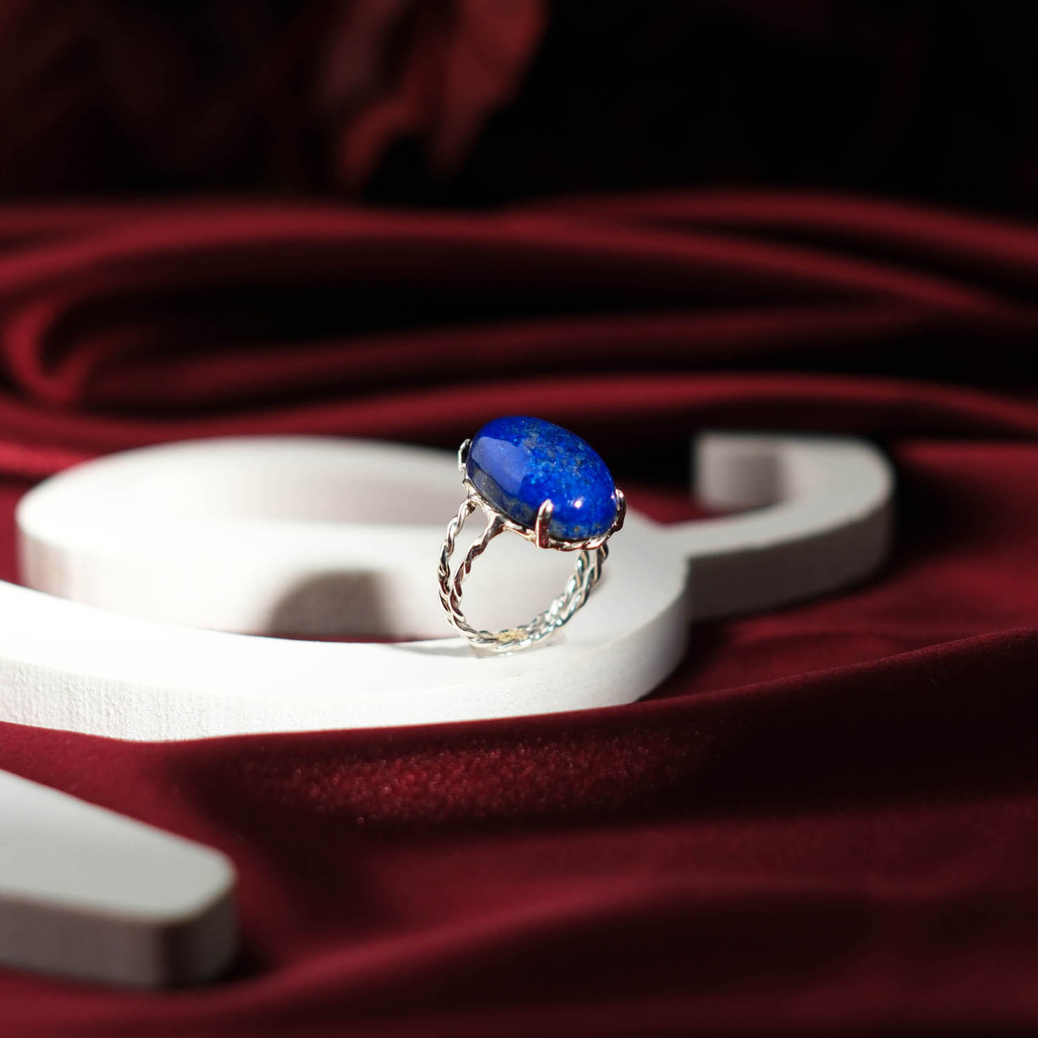 natural-lapis-lazuli-oval-cabochon-925-sterling-silver-twist-ring Genuine natural royal blue lapis lazuli oval cabochon 925 sterling silver twisted band ring.